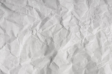 Creased paper background texture. Gray color. Full frame