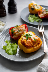 Stuffed bell peppers with rice, meat and vegetables grey neutral background. Homemade healthy food