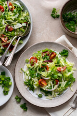Cabbage green salad. Summer vitamin fresh salad with tomatoes, parsley, onions. Detox, healthy food