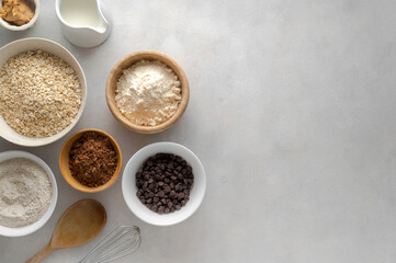 Chocolate oats brownies ingredients, cooking pastry, muffins, baking process, oat flour in bowls,...