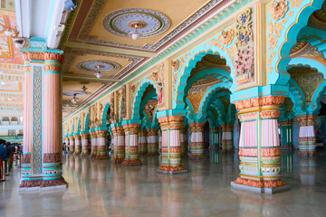 Mysore, Karnataka, India - November 25th 2018 : Beautiful decorated interior ceiling and pillars of the Durbar or audience hall inside the royal Mysore Palace. A very famous tourist attraction.