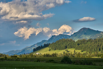 atmospheric mountain landscape with Nagelfluh mountain chain and dramazic cloud sky near Oberstaufen, Allgaeu Alps, Bavaria, Germany
