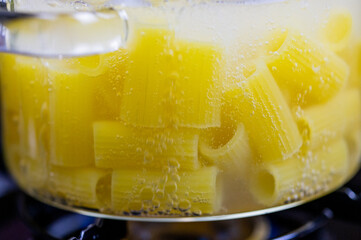 Pasta with cheese sauce. cooking noodles. European cuisine