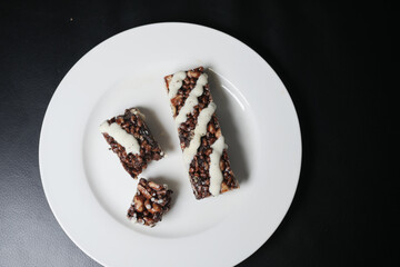 peanut, chocolate and oat protein bars on table .