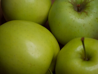 Renet simirenko green apples, top view, close-up. Macro shot of fruit.
