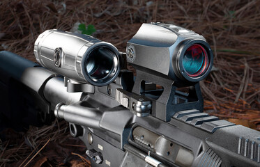 Magnifier on the side of a red dot scope on an assault rifle