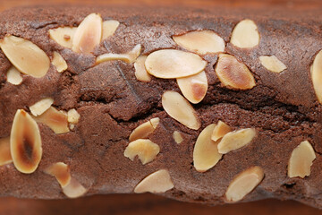 slice of bakery fruit cake on chopping board