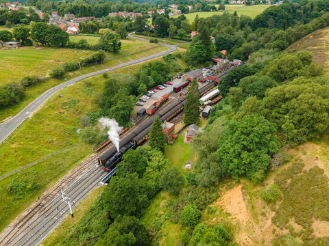 A drone view of a steam train leaving Goathland Station,
North York Moors