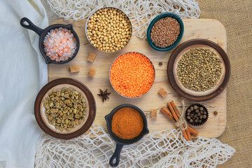 Various organic products in bowls. Eco bag for shopping. Zero waste shopping and storage farm products. Top view.