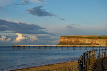Clouds start to mass above the pier at Saltburn. North Yorkshire.