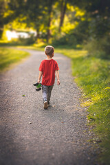 Fototapeta premium little child walking in the park