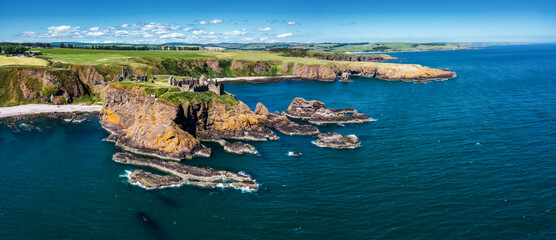 panorama drone view of Dunnottar Castle and the wild coast of Aberdeenshire