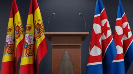 Fototapeta na wymiar Flags of Spain and North Korea at international meeting or negotiations press conference. Podium speaker tribune with flags and coat arms. 3d rendering