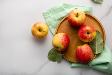 Naklejka na ściany i meble Overhead view of apples on light table food fruits