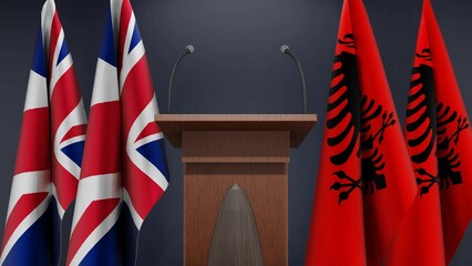 Flags of United Kingdom and Albania at international meeting or negotiations press conference. Podium speaker tribune with flags and coat arms. 3d rendering