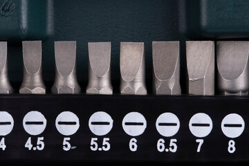 Macro detail of a set of flat screwdriver bits