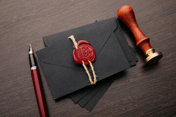 Envelope with notary public wax seal and stamp on a wooden table