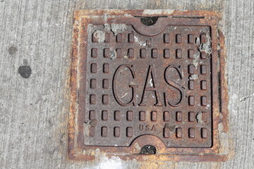 Rusted Gas Valve Cover on New York City Sidewalk