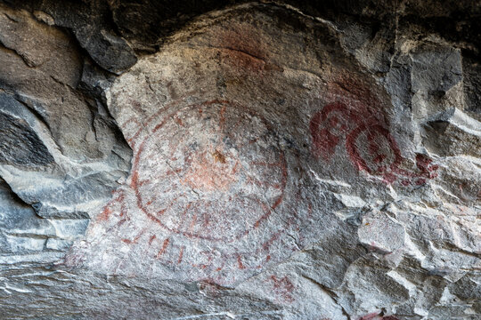 5,000 year old pictograph rock art paintings (sun) in the Mitla Caves