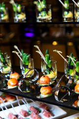 reception catering. a lot of food at the celebration of the wedding, birthday, ceremony. Beautifully decorated banquet table with a variety of vegetables, meats and seafood