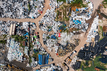 Illegal storage of solid household waste, plastic bottles and garbage bags. Land pollution. Aerial...