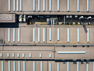 Industrial. Aerial view of large roof of factory. Drone shot from above. 