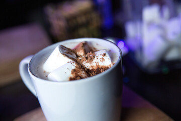 Christmas drink. Hot chocolate, marshmallow. Christmas, winter concept. Close up. Cafe background
