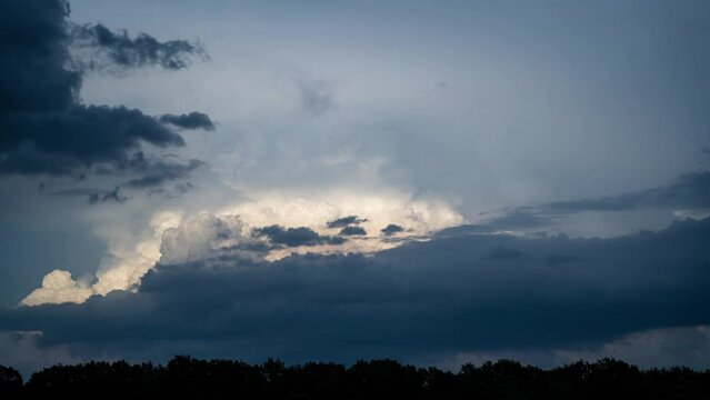 Timelaplse of big storm clouds motion on evening sky