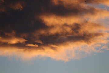 awesome dramatic stormy clouds in the sunset sky