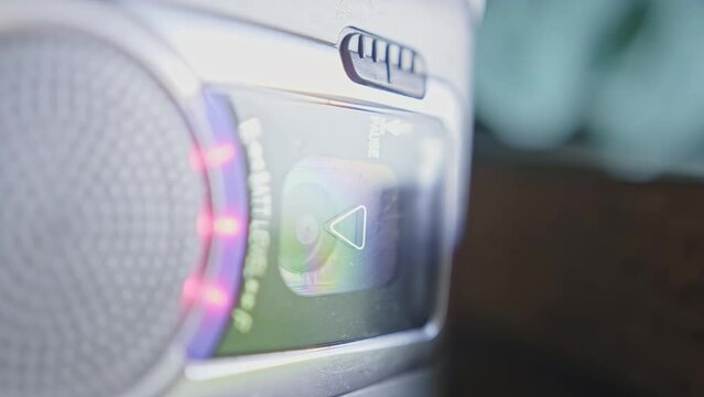 An old and grey dusty cassette recorder in the garage.