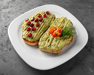 Avocado toast on a whole grain sandwich. Avocado puree. The concept of healthy food, diet, vegan, vegetarian food