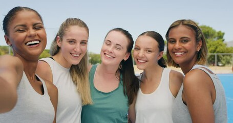 Selfie portrait of a group of diverse young fit female active athletes smiling and huddling after hockey practice on an astroturf. Team photo before we exercise and get in shape for the season