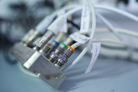 Several coax cables plugged into the splitter. This type of cable is mainly used for cable TV service.