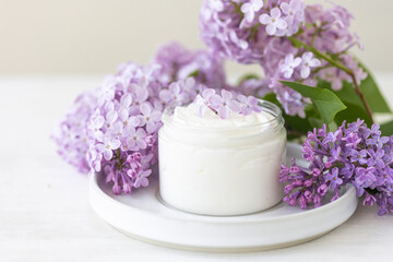 Concept of pure natural organic plant-based ingredients in cosmetology, herbal and flower extract. Lilac for anti-age and anti-acne therapy, gentle face and body skin care