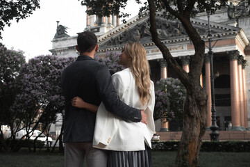 date, young couple, man and woman walking in a city park, harmonious relationship, husband and wife