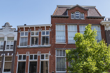 Canal view with old traditional Dutch houses in Leiden on beautiful sunny day. Leiden, North Holland, the Netherlands.