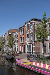 Canal view with old traditional Dutch houses in Leiden on beautiful sunny day. Leiden, North Holland, the Netherlands.