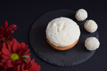 Coconut cake on a black background