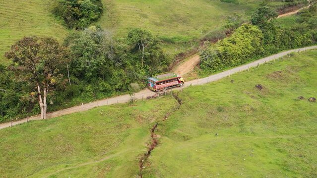 Colombian typical chiva bus in rural roads Drone - 4k