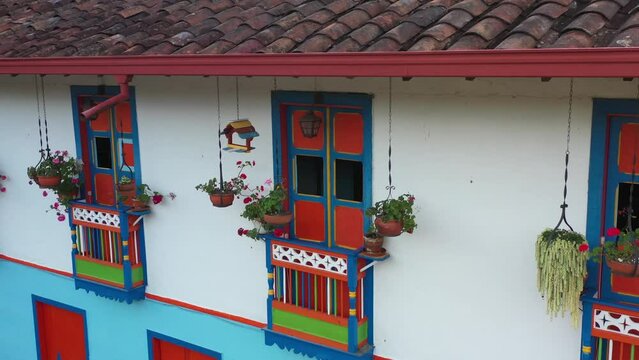 Colorful windows in colombian small town facade