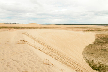 Sand dunes in Jericoacoara Ceará Brazil..Tourist and paradisiacal place with clean and beautiful skies..Vacation concept. Travel concept. Copy space.