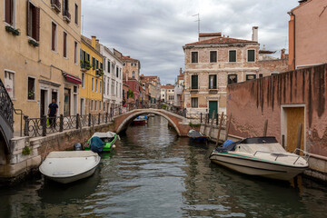 Narrow canal in the city of Venice on a summer morning