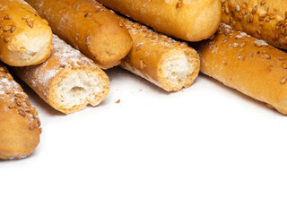 Sesame biscuits on a white background. Biscuits are elongated in the form of sticks. Bread products. Flour products. Healthy food. Crispy biscuits
