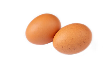 Raw eggs on the white background