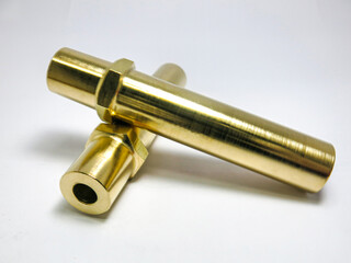 gold brass ingot The cylinder from a 45 degree angle is drilled in the center, the diagonal 2 pieces are placed diagonally on top of each other.