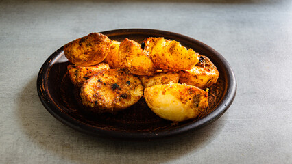 Homemade baked potatoes cooked in the 
