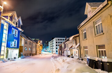 Traditional houses in Tromso at a winter night in Polar Norway