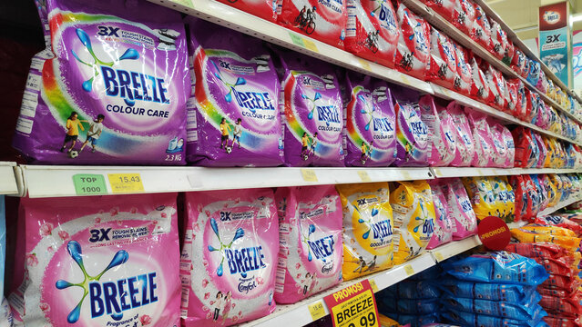 Breeze powder detergent stacked on shelves