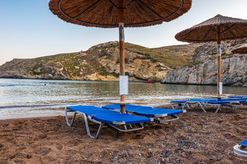 View of the famous rocky beach Melidoni in Kythira island at sunset. Amazing scenery with crystal clear water and a small rocky gulf, Mediterranean sea, Greece, Europe.