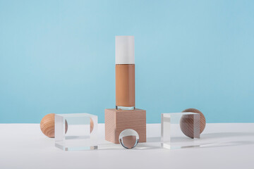 Cosmetic liquid foundation nude cream bottle mockup on acrylic and wooden block podium pedestal....